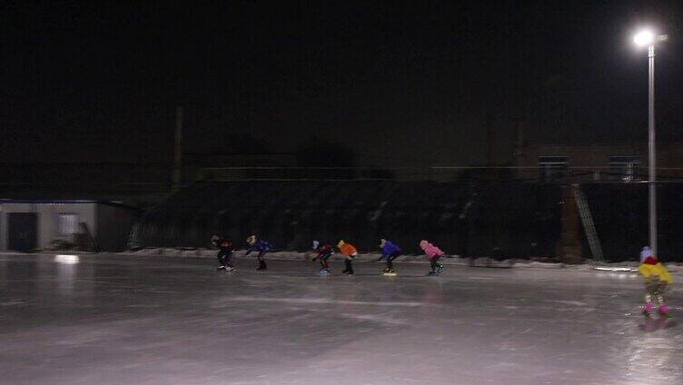 傍晚冰场滑冰孩子 滑冰训练