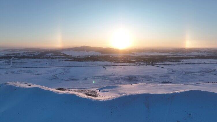 航拍呼伦贝尔雪域雪原灿烂夕阳