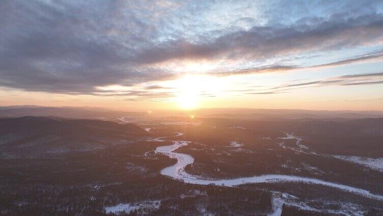 航拍林海雪原冰封河流夕照