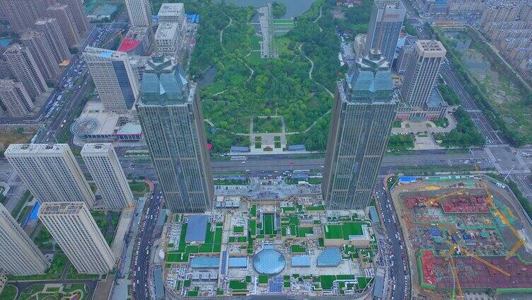 航拍枣庄新城市双子星广场夕阳下的建筑