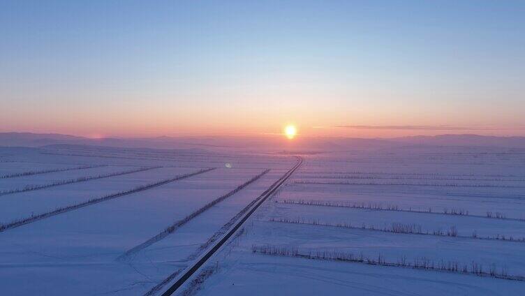 航拍内蒙古垦区雪域雪原晚霞