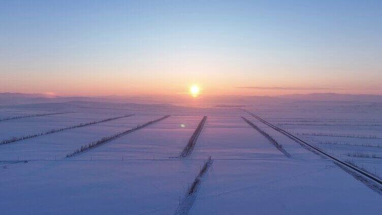 航拍内蒙古垦区雪域雪原晚霞