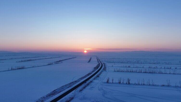 航拍内蒙古垦区雪域雪原晚霞