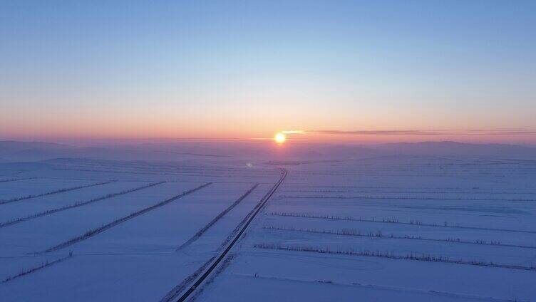 航拍内蒙古垦区雪域雪原晚霞