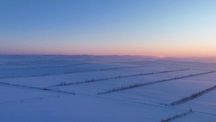 航拍内蒙古垦区雪域雪原晚霞