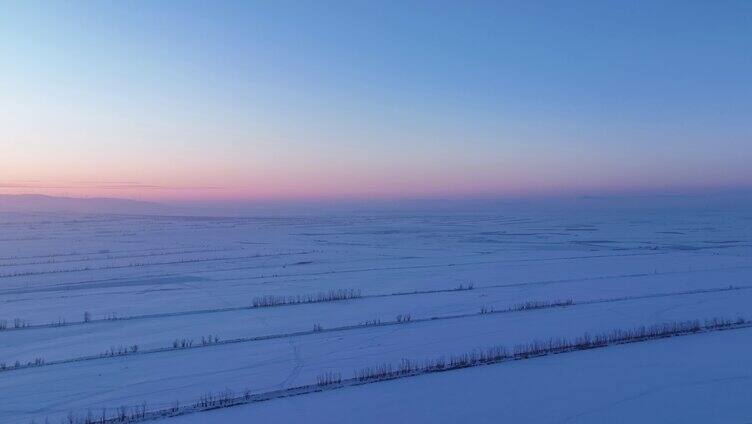 航拍内蒙古垦区雪域雪原晚霞