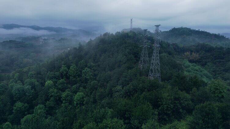 春雨森林大自然风景树林山水绿色能源电力塔