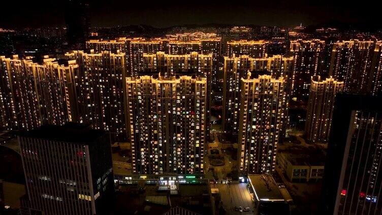 航拍-城市夜景居民楼-从窗户到城市全景