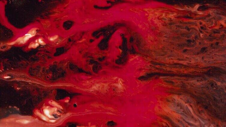 液体红色油漆混合背景与飞溅和漩涡红色抽象背景