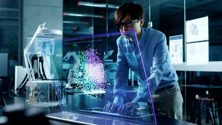 亚洲神经网络工程师使用透明全息显示的现代计算机。显示器显示交互式人工智能界面。拍摄于现代玻璃混凝土办公室。
