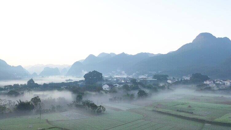 航拍贵州兴义市万峰林乡村平流雾风光