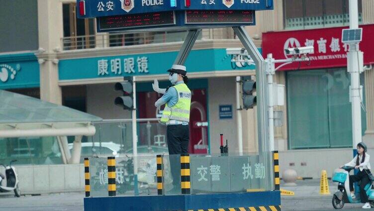 石家庄初秋早高峰女交警指挥交通车流人流