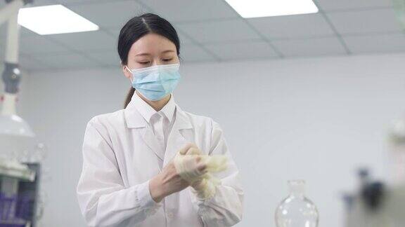 亚洲女性科学家正在为实验室工作做准备