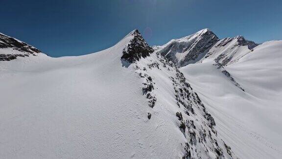 飞行近山自然冰川高山地质构造雪岩地形鸟瞰图