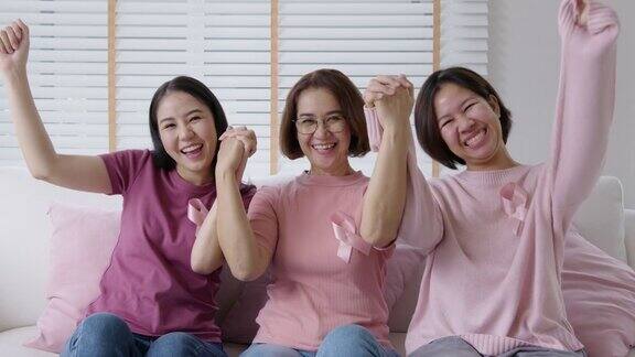 肖像组亚洲粉红妇女快乐乳癌意识运动