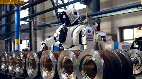 白色机器人工作与工厂细节使用螺旋枪