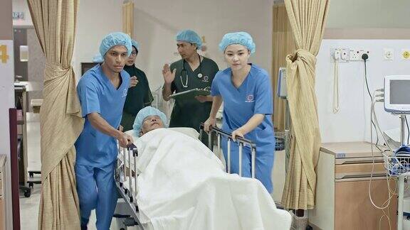 亚洲医疗队推着病床穿过走廊来到手术室