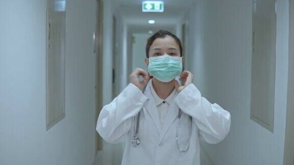 女医生戴着医用口罩走路上班慢镜头