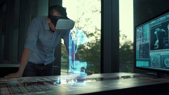 未来的男性工程师戴着虚拟现实眼镜与未来的全息工业技术机器人手臂控制未来的工业想法