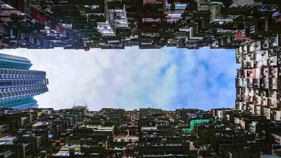 时间流逝4k视频香港公寓大楼与蓝天