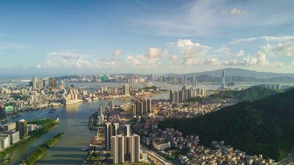 中国日落阳光明媚的一天时间珠海城市景观澳门湾航拍全景4k时间
