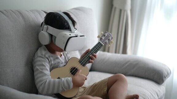 亚洲男孩在家用VR技术练习吉他和尤克里里自我学习和技术