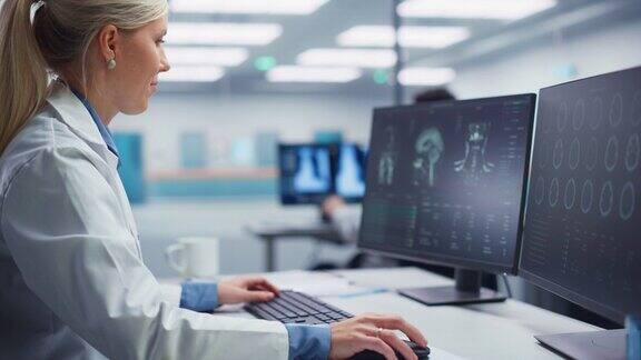 医学医院研究实验室:女性神经外科医生使用电脑扫描MRI图像为病人寻找最佳治疗方法卫生保健神经学家分析CT扫描弧的肖像