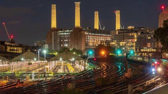 黄昏时英国伦敦巴特西发电厂和火车站的景色-4k延时