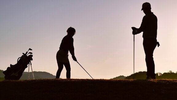剪影高尔夫球手打扫和保持高尔夫球场在夏季放松时间运动概念