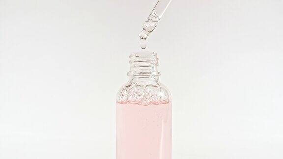 带移液器的玻璃化妆瓶设计、广告包装样品天然有机化妆品医药生产特写慢动作
