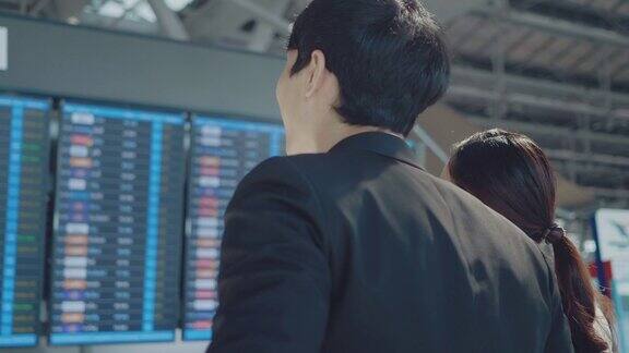 一个亚洲商人和一个女人在机场