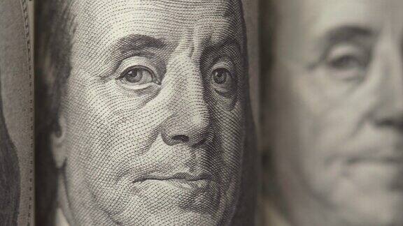 美国美元百元美钞上富兰克林的肖像在这个画框里移动现金钱的背景特写镜头