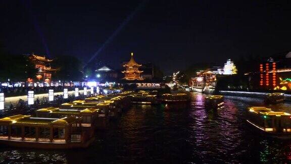 夜间照明南京古城江边游船码头前全景4k中国