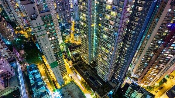 中国夜间照明生活街区公寓建筑屋顶向下观看4k时间推移