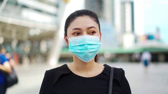 佩戴医用口罩以预防新冠肺炎大流行的商务女性