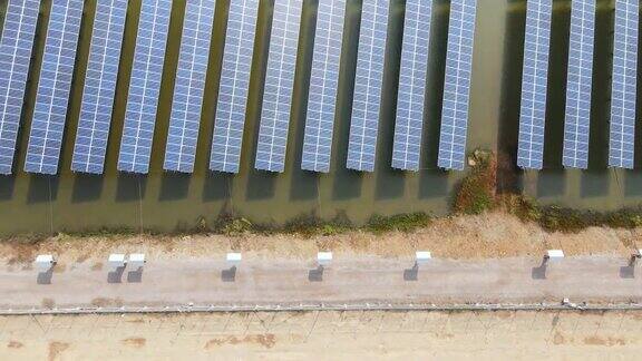 鸟瞰图太阳能电池板或太阳能电池在农场绿色能源可再生能源与环境电力生态技术