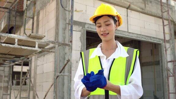 女工程师或建筑工人戴手套