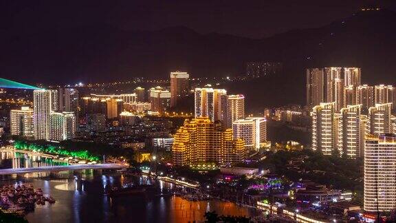 夜间照明显示三亚滨江城市景观公园顶部全景4k时间推移海南岛中国