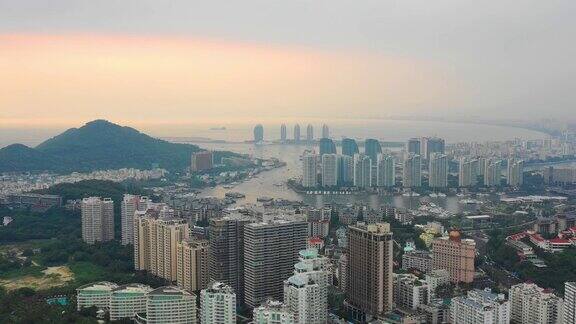 日落时分三亚港著名的大东海城市景观航拍全景4k中国海南