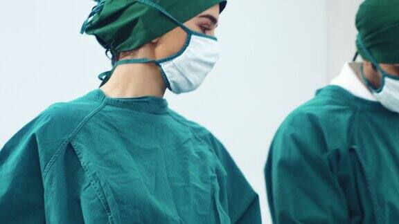 在手术室进行外科手术的专业医生和团队