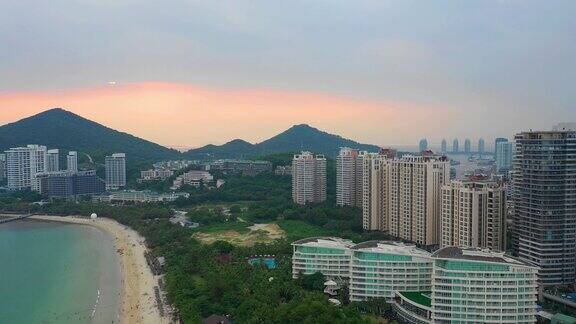 日落天空三亚市风景著名的大东海海滩航拍全景4k中国海南