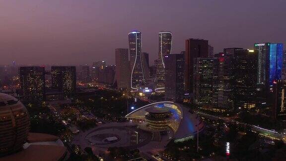 日落黄昏照明杭州市区交通现代主要广场空中全景4k中国