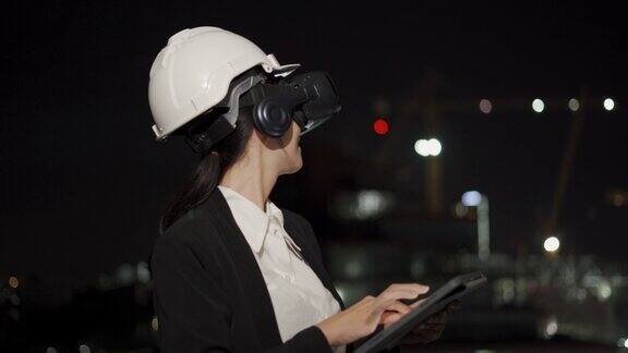 亚洲工程师戴着虚拟现实头盔