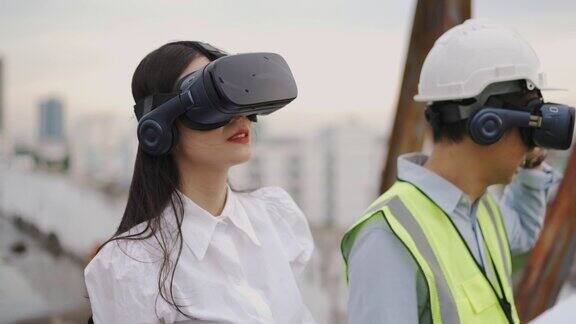亚洲工程师戴着VR头盔