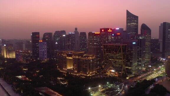 日落黄昏照明杭州市区交通现代主要广场空中全景4k中国
