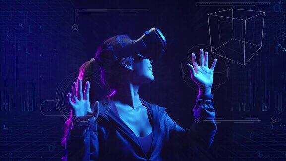 青少年玩VR虚拟现实眼镜运动游戏3D网络空间未来霓虹五彩背景未来数字技术游戏和娱乐
