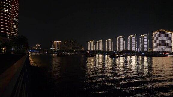 夜晚的时间照亮三亚市湾公寓综合楼全景4k中国海南