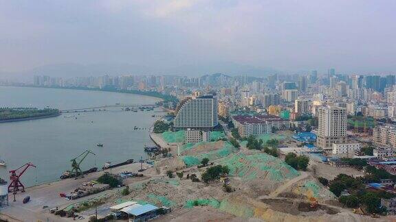傍晚时分海南岛三亚湾酒店建设航拍4k中国全景图