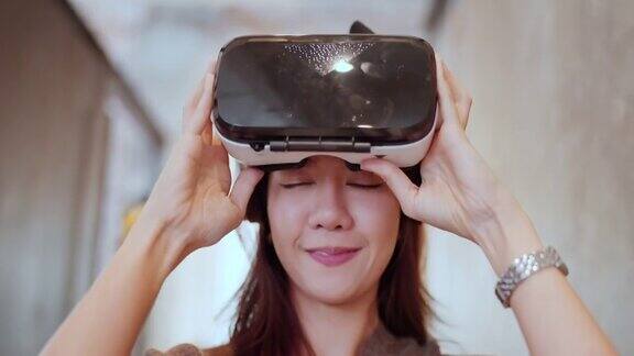 亚洲程序员女性女性戴着vr护目镜3d可视化行走和探索在元宇宙未来的生活方式在现代办公背景下新常态技术虚拟数字世界探索