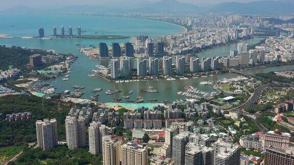 阳光明媚的三亚著名的大东海城市景观岛航拍全景4k海南中国